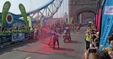 Moment Youth Demand protesters are dragged out of path of London Marathon men's elite race and tackled by police