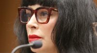 Weezer bassist's wife cleans up her style act for first court date after being shot by cops