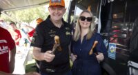 Prime Minister Anthony Albanese with partner Jodie Haydon with some sausages in Perth.