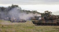 An Australian Army trooper fires the .50 cal heavy machine gun from an Australian Army M1A1 Abrams Main Battle Tank during Exercise Gauntlet Strike at the Puckapunyal Military Area in Victoria, Australia, on June 26, 2024.