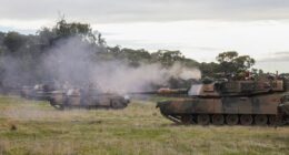 An Australian Army trooper fires the .50 cal heavy machine gun from an Australian Army M1A1 Abrams Main Battle Tank during Exercise Gauntlet Strike at the Puckapunyal Military Area in Victoria, Australia, on June 26, 2024.