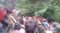 At least 21 killed after bus skids and plummets down mountain by popular scenic waterfall in Sri Lanka