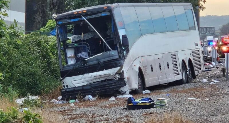 At least one dead and 32 injured after tour bus collides with car that burst into flames in horror Mother’s Day crash