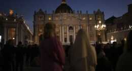 People gather in St Peter's Square as they wait to see the smoke billow from the chimney of the Sistine Chapel in St Peter's Square during the cardinals' conclave to elect a new pope, at the Vatican, Wednesday, May 7, 2025.