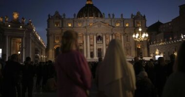 People gather in St Peter's Square as they wait to see the smoke billow from the chimney of the Sistine Chapel in St Peter's Square during the cardinals' conclave to elect a new pope, at the Vatican, Wednesday, May 7, 2025.