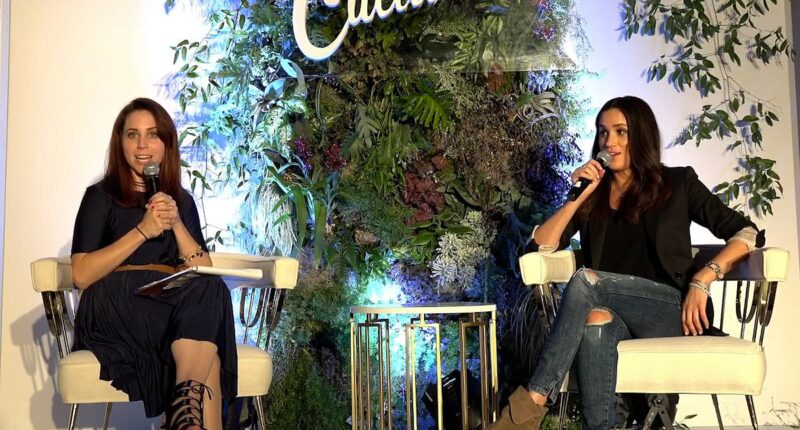 Body language expert reveals the meaning behind Meghan Markle's uncomfortable 14 second encounter with audience at 'awkward' conference