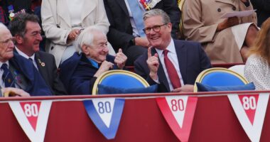 D-Day hero, 99, who ferried Allied troops onto beaches of Normandy as a teenager laughs with Keir Starmer during VE Day procession - ahead of tea with the King at Buckingham Palace
