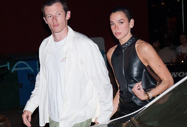 Dua Lipa sizzled in a leather black mini dress as she joined her fiancé Callum Turner for a date night in New York City on Friday