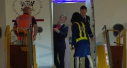 Emmanuel Macron's wife seen shoving him in the face in viral clip as France's first couple arrives in Vietnam