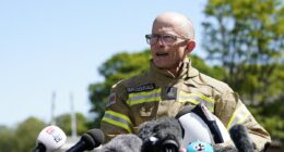 Fire chief chokes with emotion as he tells of 'heavy heart' after death of two brave colleagues in Bicester heritage car centre blaze as two more are treated in hospital following inferno