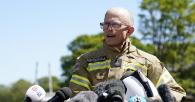Fire chief chokes with emotion as he tells of 'heavy heart' after death of two brave colleagues in Bicester heritage car centre blaze as two more are treated in hospital following inferno