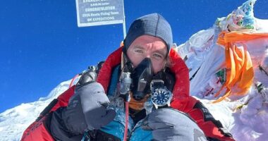 Former Royal Marine from 'the flattest part of the UK' completes the world's longest triathlon and scales Mount Everest - eight months after leaving Dover