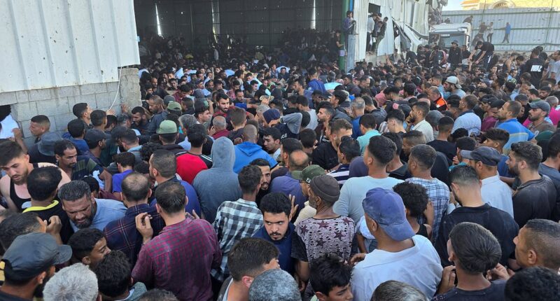 Four dead as thousands of Palestinians loot aid warehouse in Gaza