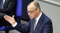 Germany finally appoints Friedrich Merz as chancellor in second round of voting after day of chaos in Berlin