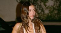 Hailey Bieber nearly spills out of low-cut dress before flashing backside in bikini on wild Miami trip without Justin Bieber