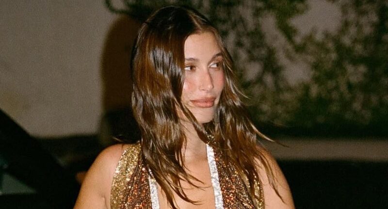 Hailey Bieber nearly spills out of low-cut dress before flashing backside in bikini on wild Miami trip without Justin Bieber