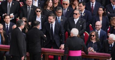 JD Vance shakes Zelensky's hand at Pope Leo's inauguration mass after war of words between pair and US Vice President