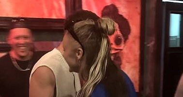 JoJo Siwa and Chris Hughes pictured KISSING in a pool on romantic adults-only holiday as their relationship is finally confirmed