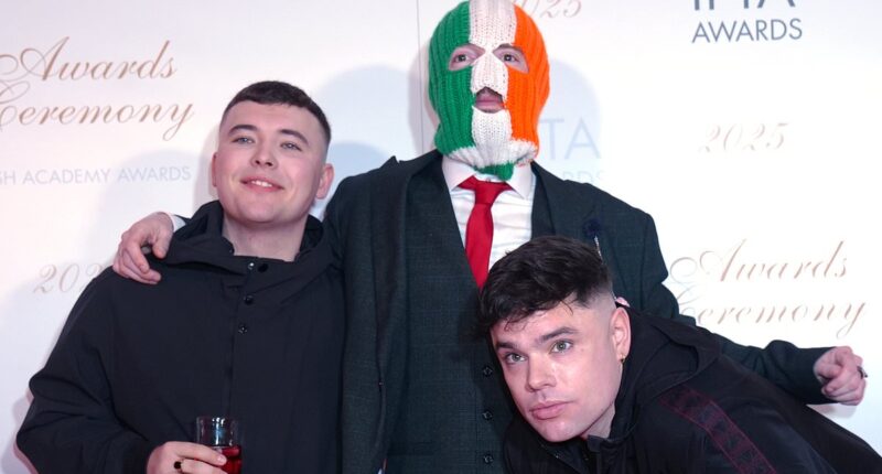 Kneecap's Liam O'Hanna is charged with terrorism offences after 'displaying a flag in support for Hezbollah'