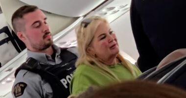 Moment 'mother and wannabe influencer daughter' are taken away by police after forcing UK flight to Jamaica to divert to Canada after parent 'shouted and swore at staff demanding to get off in mid-air'