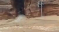 Mum and son found dead after flash flooding in tourist hotspot as hundreds are evacuated