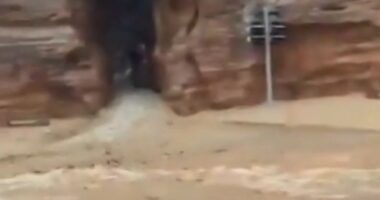 Mum and son found dead after flash flooding in tourist hotspot as hundreds are evacuated