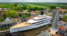 Plush £150m superyacht laden with luxuries like jacuzzi & helipad owned by ex-Starbucks CEO squeezes through Dutch canal