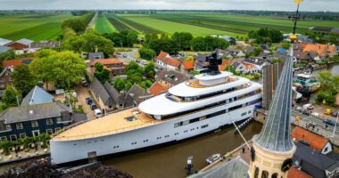 Plush £150m superyacht laden with luxuries like jacuzzi & helipad owned by ex-Starbucks CEO squeezes through Dutch canal