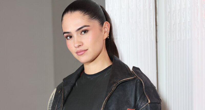 Romeo Beckham's girlfriend Kim Turnbull puts on a brave face at Maison Crivelli event in London as she's pulled into the 'family feud'