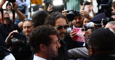 Russell Brand Arrives at London Court for First Hearing on Rape Charges