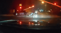 Shock vid shows hero cops pull driver from car just SECONDS before its obliterated by speeding train on level crossing