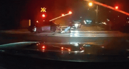 Shock vid shows hero cops pull driver from car just SECONDS before its obliterated by speeding train on level crossing
