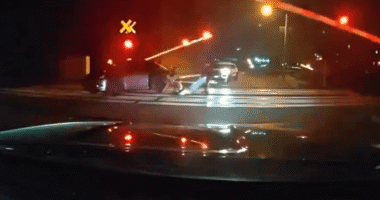 Shock vid shows hero cops pull driver from car just SECONDS before its obliterated by speeding train on level crossing