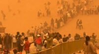 Terrifying moment apocalyptic SANDSTORM engulfs 10,000 tourists leaving air thick with orange dust sparking evacuations