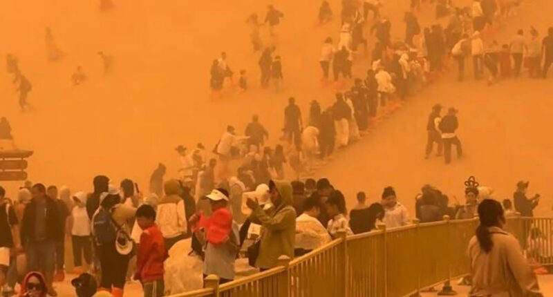 Terrifying moment apocalyptic SANDSTORM engulfs 10,000 tourists leaving air thick with orange dust sparking evacuations