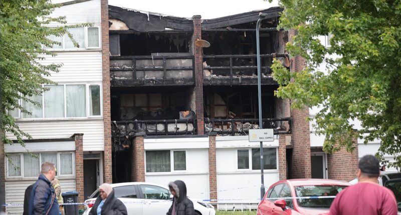 Three children aged four, eight and 15 and 43-year-old woman are killed in house fire as police arrest man
