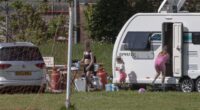 Travellers invade school playing fields forcing furious head teacher to relocate lessons and admit it will be difficult to evict them