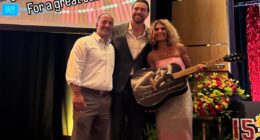 Travis Kelce poses with fans who bought stunning Taylor Swift merch at Patrick Mahomes' charity event