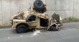 Two injured after military vehicle crashes over highway retaining wall, plunges 30 feet onto road below