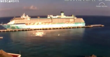 UFO zooms past cruise ship at ‘almost imperceptible speed’ in eerie video as onlookers gasp ‘what was that?!’