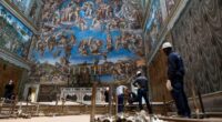 Vatican workers install Sistine Chapel stove where ballots are burned during conclave to elect pope