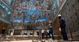 Vatican workers install Sistine Chapel stove where ballots are burned during conclave to elect pope