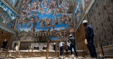 Vatican workers install Sistine Chapel stove where ballots are burned during conclave to elect pope
