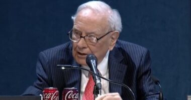 Warren Buffett stuns crowd as he steps down from Berkshire... and issues stark warning to Trump