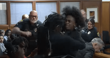 Watch moment massive courtroom brawl erupts as mom of murdered teen, 14, confronts his killer’s family