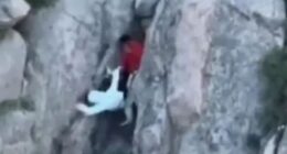 Watch shock moment couple cheat death as they fall off 5,000ft mountain while taking risky shortcut to avoid queue