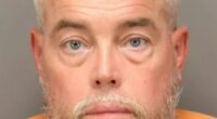 Winner of $167.3m Powerball pot ‘punches man before kicking cop in hotel brawl’ days after landing state’s biggest prize