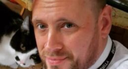 'Superhero' security guard who fought off racist thug who trashed Tesco store was fired and charged with assault after a witness complained