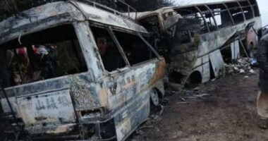 At least 40 killed as two buses crash and burst into flames – leaving terrified passengers trapped inside vehicles