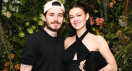 Brooklyn Beckham's friends say they are 'not surprised' he failed to acknowledge David's knighthood - as Victoria and brothers shower father with pride